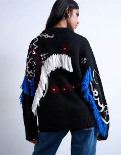 Model wearing Knitted premium oversized embroidered jumper in black