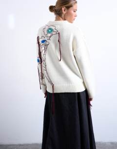 Model wearing Knitted premium oversized embroidered jumper in ivory