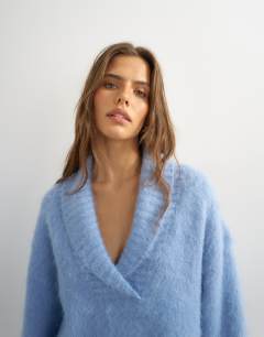 Model wearing Knitted premium shawl collar jumper with wool in blue