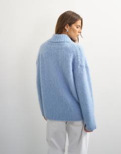 Model wearing Knitted premium shawl collar jumper with wool in blue