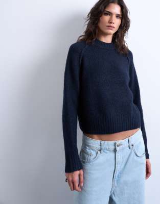 Knitted raglan exposed seam jumper in navy