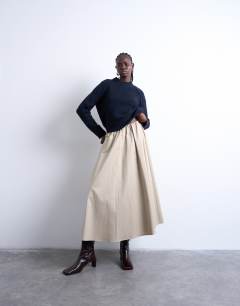 Model wearing Knitted raglan exposed seam jumper in navy