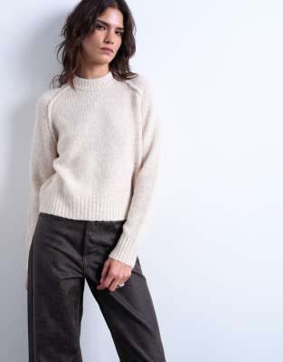Knitted raglan exposed seam jumper in oat