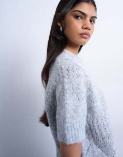 Model wearing Knitted relaxed fit short sleeve t-shirt top in light grey