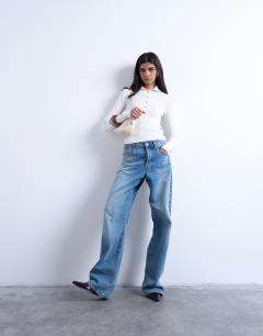 Model wearing Knitted rib collar polo in ivory