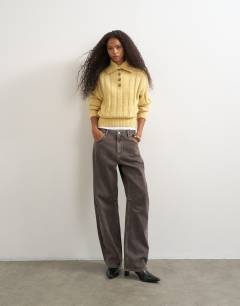 Model wearing Knitted rib funnel neck jumper in eggnog