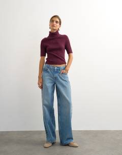 Model wearing Knitted rib yoke funnel neck top in mulberry