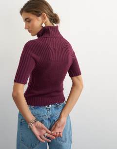 Model wearing Knitted rib yoke funnel neck top in mulberry