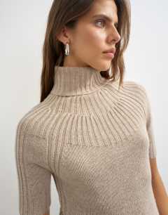 Model wearing Knitted rib yoke funnel neck top in oat