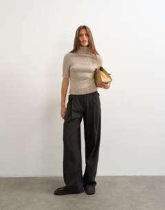 Model wearing Knitted rib yoke funnel neck top in oat