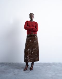 Model wearing Knitted ribbed button crew cardigan in red