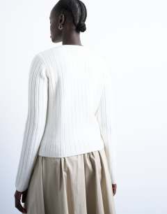 Model wearing Knitted ribbed button crew cardigan in white