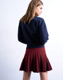 Model wearing Knitted ribbed co-ord mini skirt in burgundy