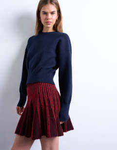 Model wearing Knitted ribbed co-ord mini skirt in burgundy