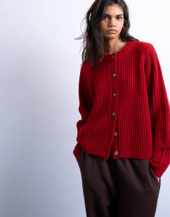 Model wearing Knitted ribbed crew relaxed button cardigan in red