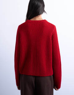 Model wearing Knitted ribbed crew relaxed button cardigan in red