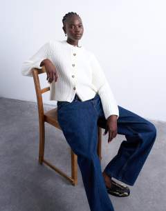 Model wearing Knitted ribbed crew relaxed button cardigan in white