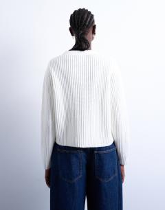 Model wearing Knitted ribbed crew relaxed button cardigan in white