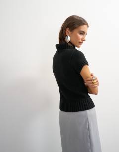 Model wearing Knitted ribbed funnel neck chunky short sleeve top in black
