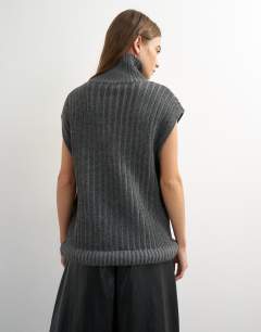 Model wearing Knitted ribbed funnel neck wool longline top with tube hem in coal