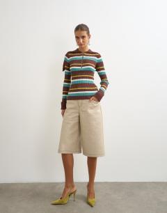 Model wearing Knitted ribbed long sleeve half zip funnel jumper in brown stripe