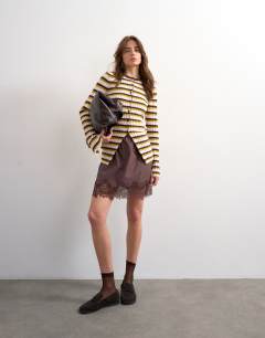 Model wearing Knitted ribbed stripe button cardigan in multi
