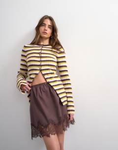 Model wearing Knitted ribbed stripe button cardigan in multi