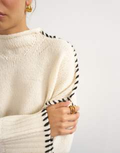 Model wearing Knitted roll edge blanket stitch jumper in ivory