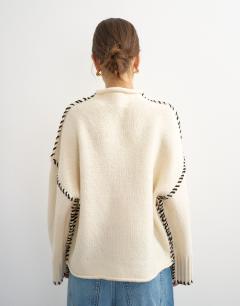 Model wearing Knitted roll edge blanket stitch jumper in ivory