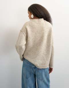 Model wearing Knitted roll edge relaxed fit jumper with wool in oat