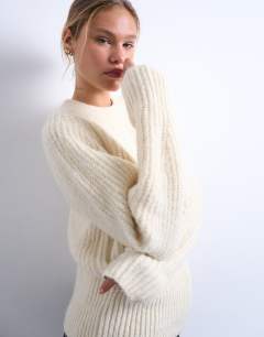 Model wearing Knitted rounded sleeve jumper in ivory