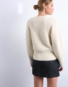 Model wearing Knitted rounded sleeve jumper in ivory