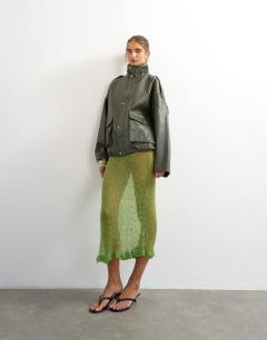 Model wearing Knitted ruffle hem pointelle midi skirt with wool in green