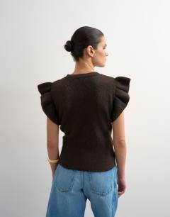 Model wearing Knitted Ruffle Short Sleeve Top in Brown