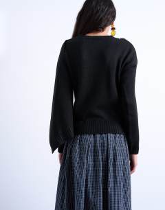 Model wearing Knitted scarf jumper in black