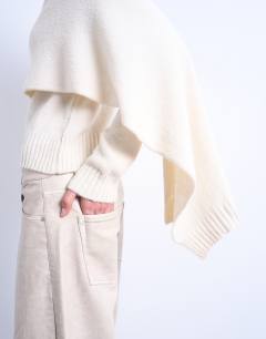 Model wearing Knitted scarf jumper in cream