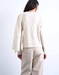 Model wearing Knitted scarf jumper in cream