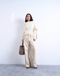 Model wearing Knitted scarf jumper in cream