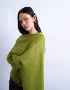 Model wearing Knitted scarf jumper in olive green