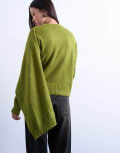 Model wearing Knitted scarf jumper in olive green