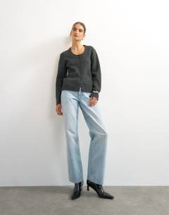 Model wearing Knitted scoop neck cardigan in coal