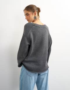 Model wearing Knitted scoop neck jumper in charcoal