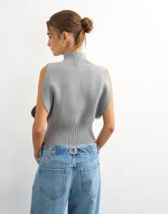 Model wearing Knitted sculpted sleeveless funnel neck jumper in grey