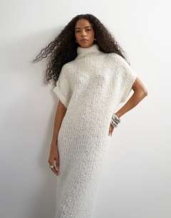 Model wearing Knitted sheer funnel neck maxi dress with wool in ivory