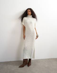 Model wearing Knitted sheer funnel neck maxi dress with wool in ivory