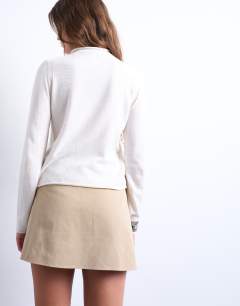 Model wearing Knitted sheer high neck jumper in ivory