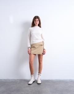 Model wearing Knitted sheer high neck jumper in ivory