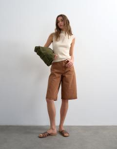 Model wearing Knitted sheer mix cap sleeve top in ivory