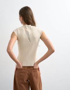 Model wearing Knitted sheer mix cap sleeve top in ivory