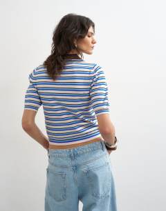 Model wearing Knitted short sleeve fitted stripe polo top in multi